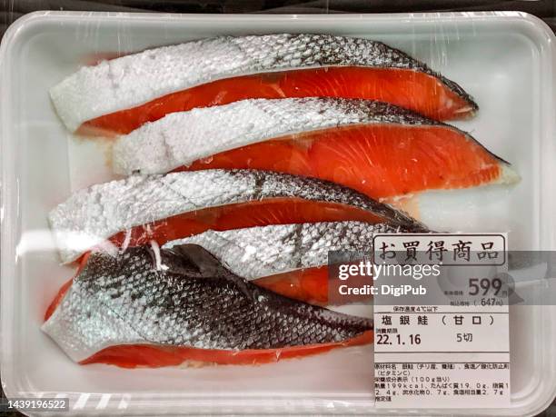 salted silver salmon fish fillets from chile, wrapped with stretch film - skin tag stock pictures, royalty-free photos & images