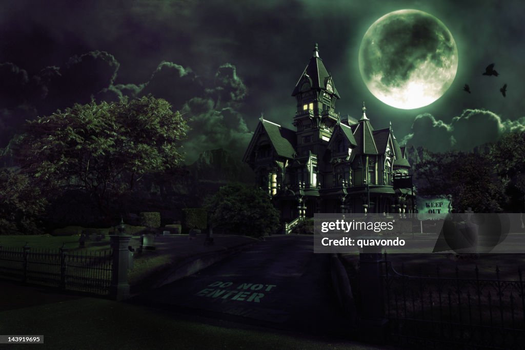 Full Moon Over Haunted House with Graveyard for Halloween