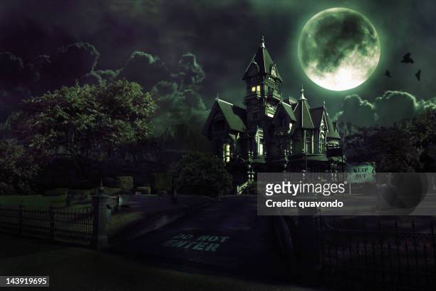 full moon over haunted house with graveyard for halloween - spooky stock pictures, royalty-free photos & images