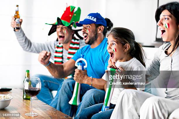 italian supporters - family watching television stock pictures, royalty-free photos & images