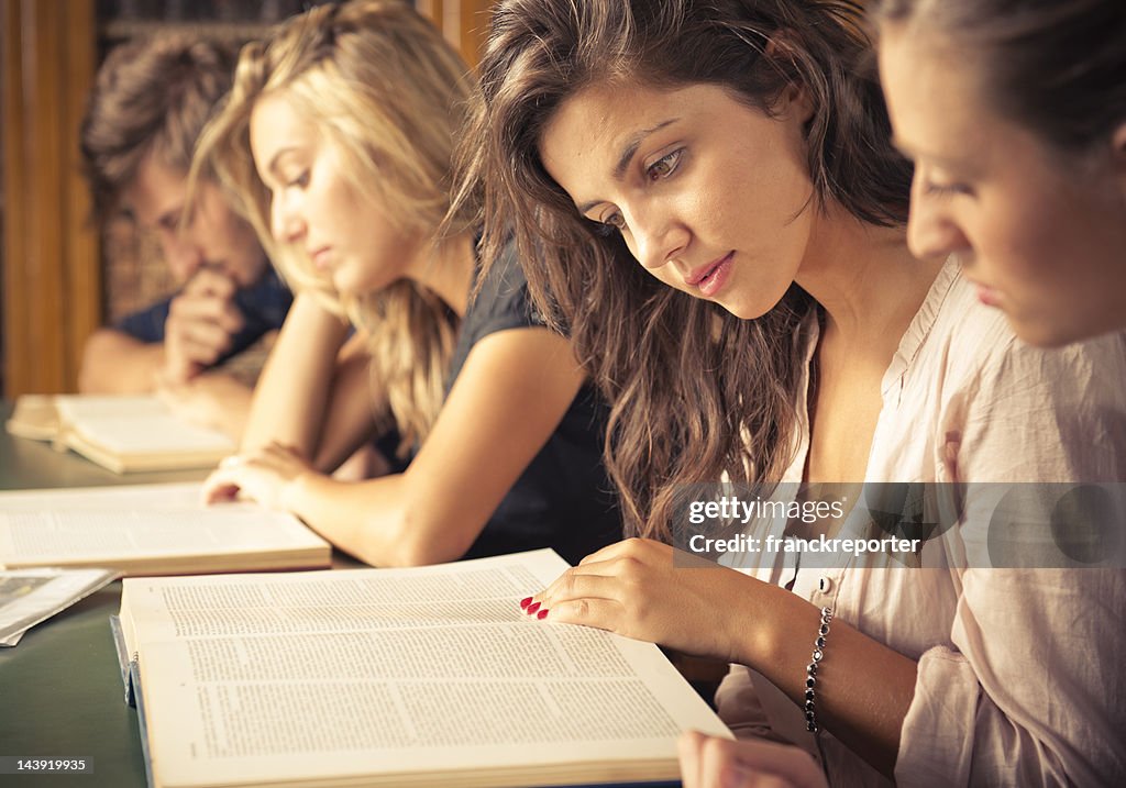 Students in the library studying together