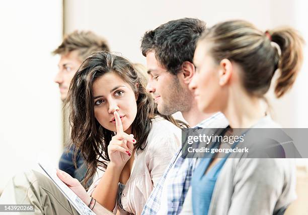 students in a lecture - shhh! - shhh finger stock pictures, royalty-free photos & images