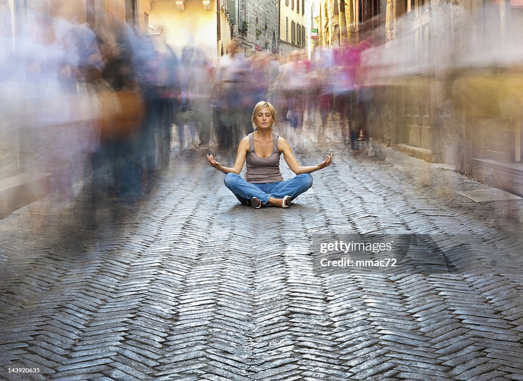 Woman Relaxing in a Crowded Street