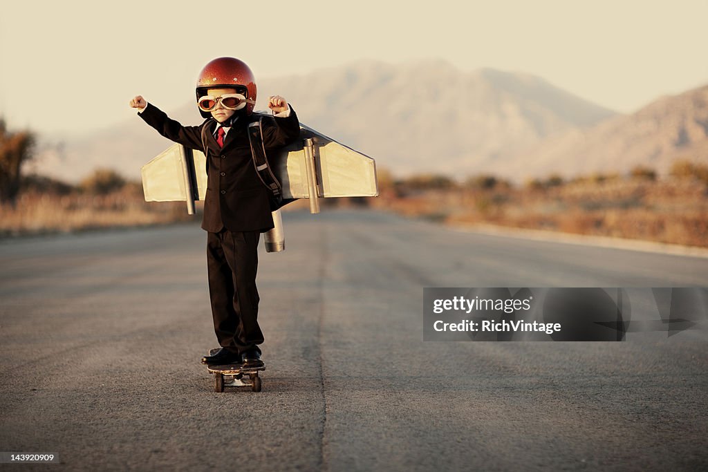 Young Boy 着のビジネススーツとジェットパック