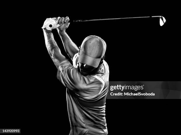 dramatic swing - golf swing stock pictures, royalty-free photos & images