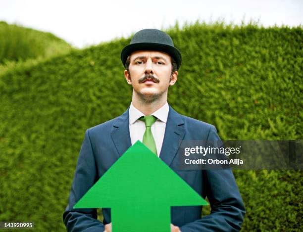 klassische business mit pfeilmotiv - green suit stock-fotos und bilder