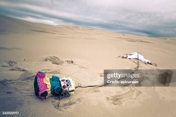 party gone wrong - dead body sand stock pictures, royalty-free photos & images