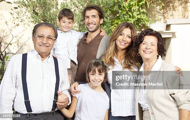 sunny portrait of classic, italian family - family reunion stock pictures, royalty-free photos & images