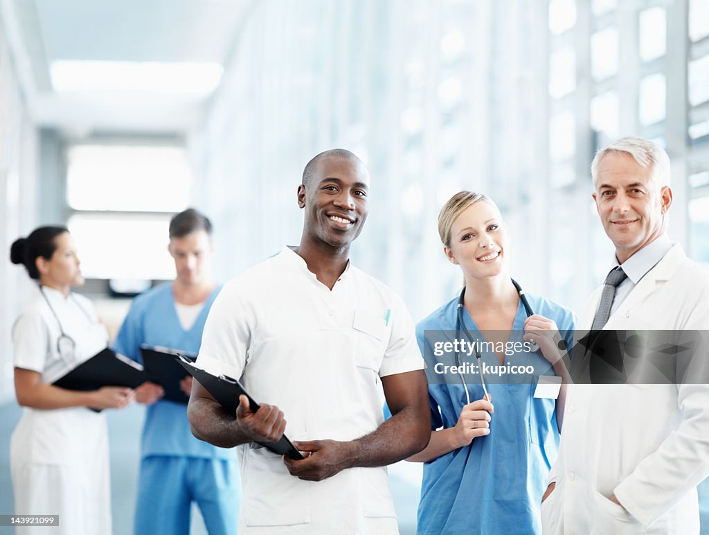 Senior male doctor and his medical team