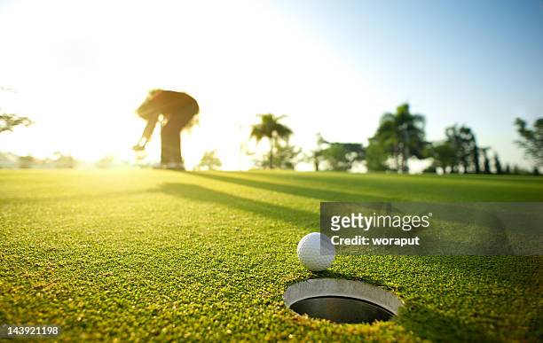 missed putt - golf putter stock pictures, royalty-free photos & images
