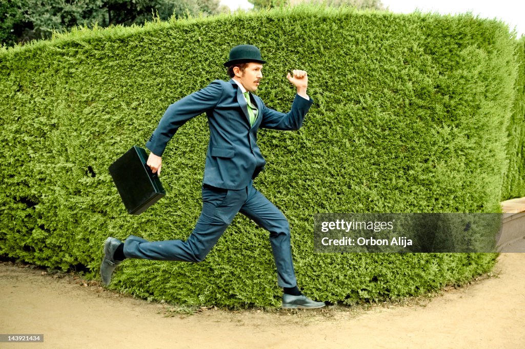 Classic businessman running