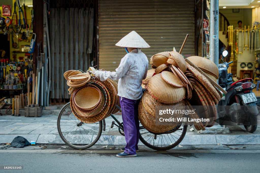 Vietnamese Bicycle Worker with Hat Hanoi, Vietnam