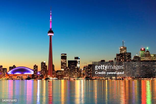 toronto skyline by night - toronto stock pictures, royalty-free photos & images