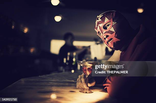 mexican luchador at a bar - lucha libre stock pictures, royalty-free photos & images