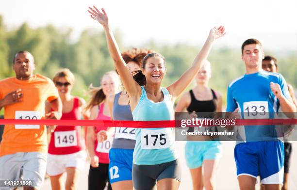 group of runners in a cross country race. - championship ribbon stock pictures, royalty-free photos & images