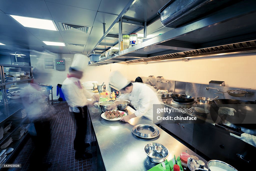 Motion chefs  of a restaurant kitchen