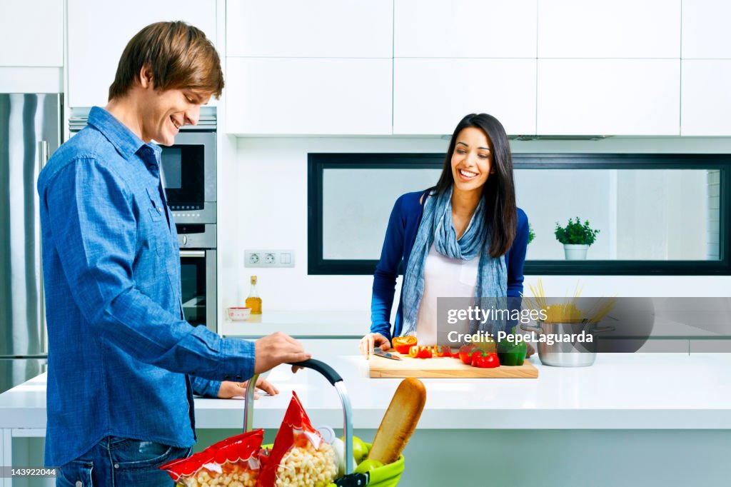 Couple at a modern kitchen.