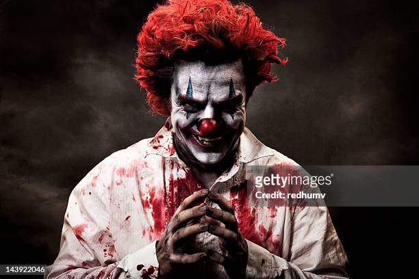 digitally altered image of evil, bloody clown - joker stock pictures, royalty-free photos & images