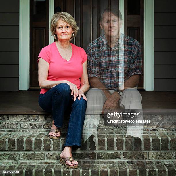 worried elderly man sitting outside the house - the house of spirits stock pictures, royalty-free photos & images