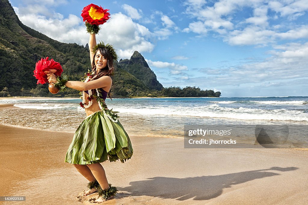 Hawaiian Hula Dancer on Beach with Red Feather Shakers