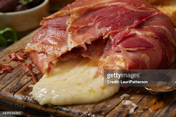 baked prosciutto wrapped brie - prosciutto stock pictures, royalty-free photos & images