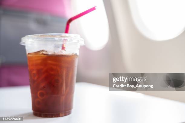 an iced americano (black coffee) on the table. - plastic disposable cup stock pictures, royalty-free photos & images