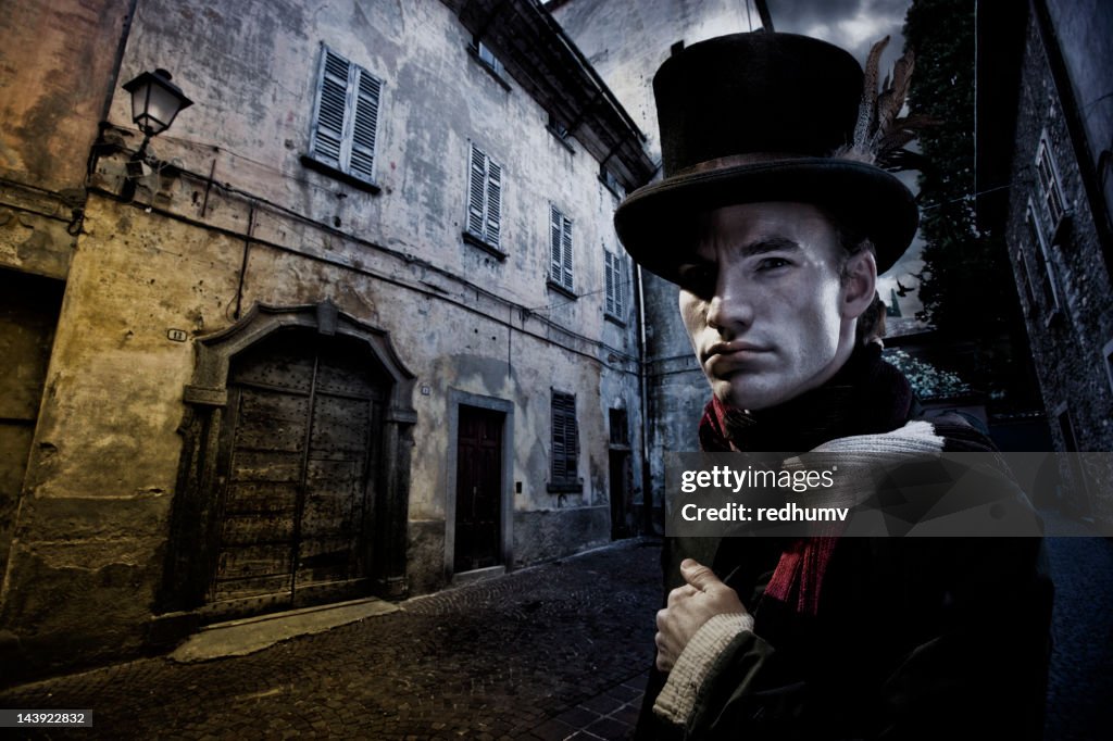 Vintage Man in tophat and Cobblestone Street