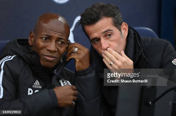 Marco Silva, Manager of Fulham speaks to their assistant Luis Boa Morte during the Premier League match between Manchester City and Fulham FC at...