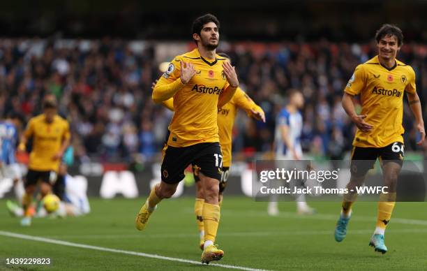 Goncalo Guedes of Wolverhampton Wanderers celebrates after scoring their team's first goal during the Premier League match between Wolverhampton...