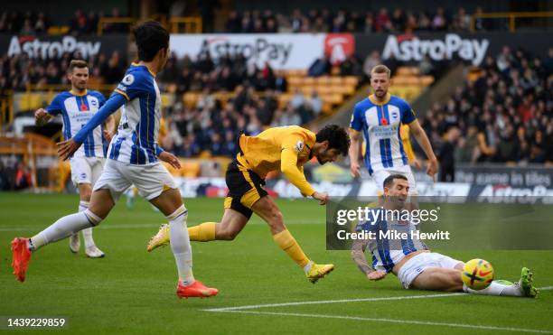 Goncalo Guedes of Wolverhampton Wanderers scores their team's first goal during the Premier League match between Wolverhampton Wanderers and Brighton...