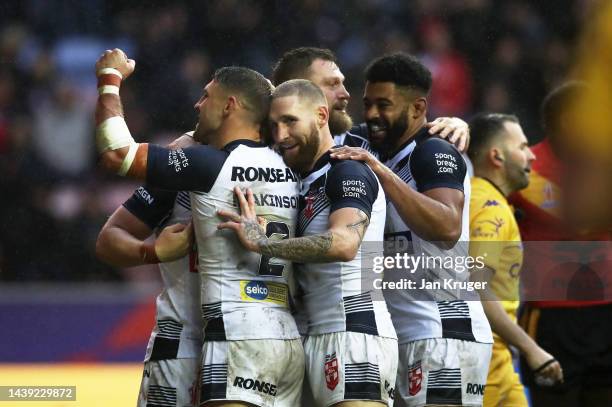 George Williams of England celebrates their sides fifth try with team mates during Rugby League World Cup Quarter Final match between England and...