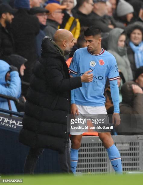 Joao Cancelo of Manchester City leaves the pitch after being red carded during the Premier League match between Manchester City and Fulham FC at...