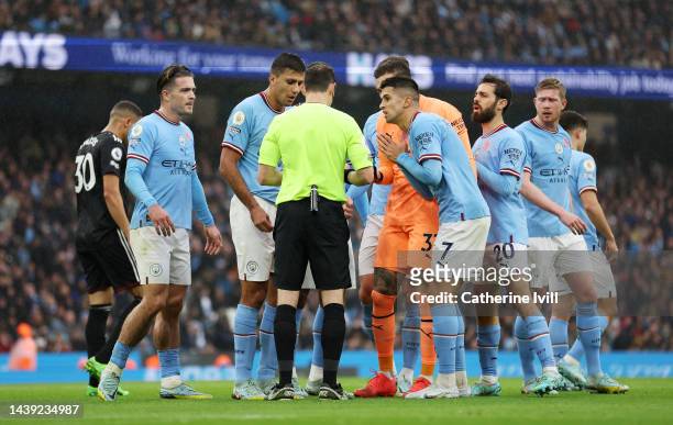 Joao Cancelo of Manchester City appeals to Referee Darren England after being red carded for a foul in the box during the Premier League match...