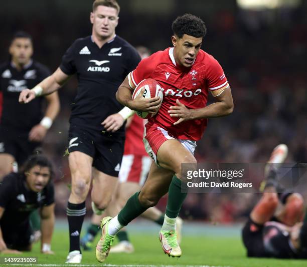 Rio Dyer of Wales breaks clear to score their first try during the Autumn International match between Wales and New Zealand All Blacks at the...