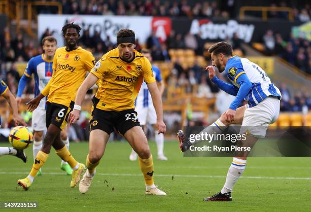 Adam Lallana of Brighton & Hove Albion scores their team's first goal during the Premier League match between Wolverhampton Wanderers and Brighton &...