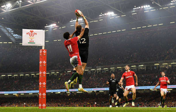 CARDIFF, WALES - NOVEMBER 05: Jordie Barrett of New Zealand beats Rio Dyer of Wales to the high ball on the way to scoring his sides third try during the Autumn International match between Wales and New Zealand at Principality Stadium on November 05, 2022 in Cardiff, Wales. (Photo by Dan Mullan/Getty Images)