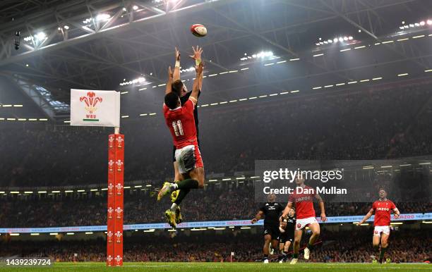 Jordie Barrett of New Zealand beats Rio Dyer of Wales to the high ball on the way to scoring his sides third try during the Autumn International...