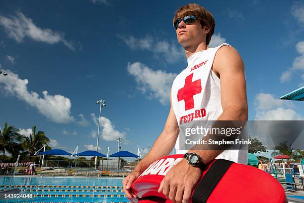 lifeguard on duty at swimming pool - life guard stock pictures, royalty-free photos & images