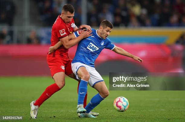 Andrej Kramaric of TSG Hoffenheim is challenged by Willi Orban of RB Leipzig during the Bundesliga match between TSG Hoffenheim and RB Leipzig at...
