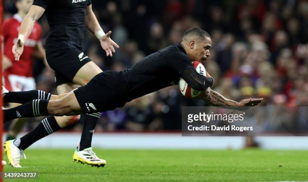 Aaron Smith of New Zealand dives to score their fouth try during the Autumn International match between Wales and New Zealand All Blacks at the...