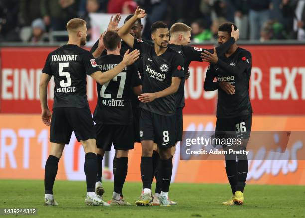 The players of Frankfurt celebrate after the final whistle of the Bundesliga match between FC Augsburg and Eintracht Frankfurt at WWK-Arena on...