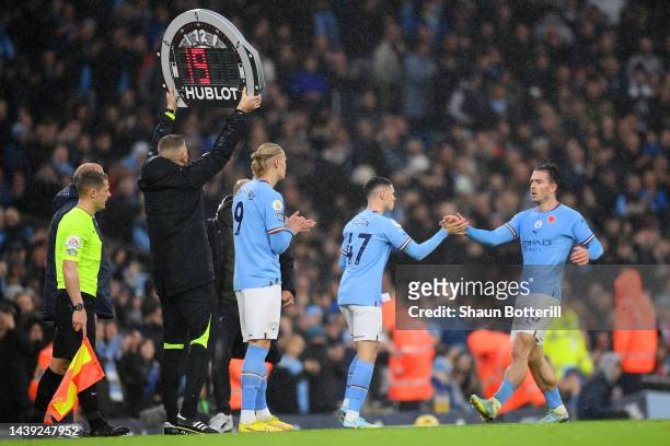 Erling Haaland replaces Jack Grealish of Manchester City during the Premier League match between Manchester City and Fulham FC at Etihad Stadium on...