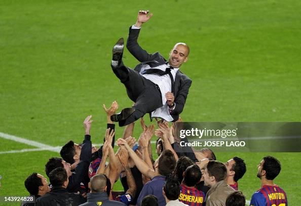 Barcelona's players throu to the air to Barcelona's players throu to the air to