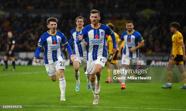 Pascal Gross of Brighton & Hove Albion celebrates after scoring their team's third goal during the Premier League match between Wolverhampton...