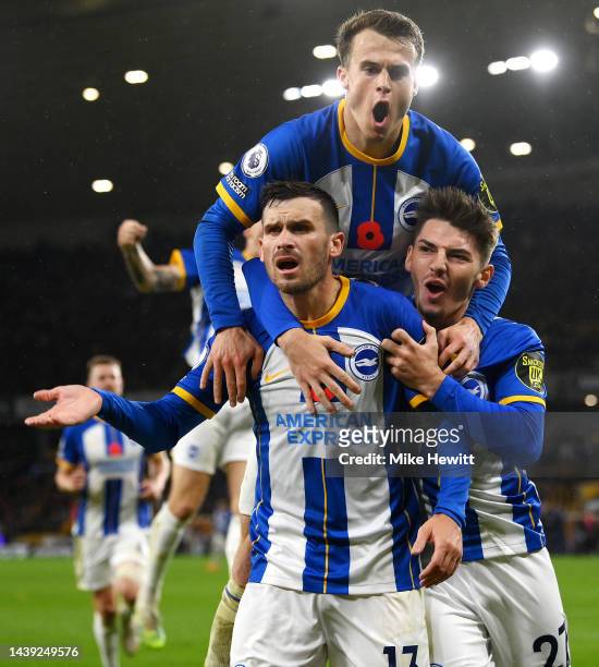 Pascal Gross of Brighton & Hove Albion celebrates with teammates after scoring their team's third goal during the Premier League match between...
