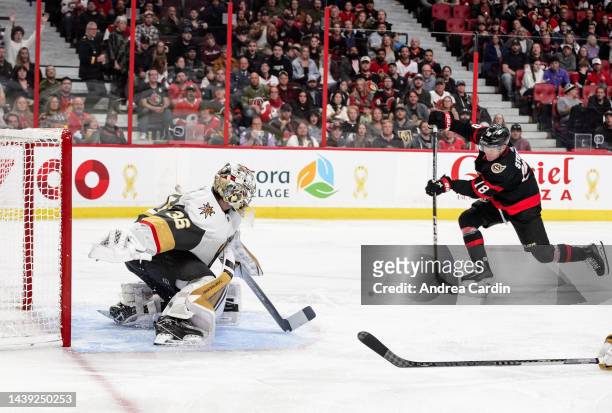 Tim Stützle of the Ottawa Senators shoots the puck to score a third period goal against Logan Thompson of the Vegas Golden Knights at Canadian Tire...