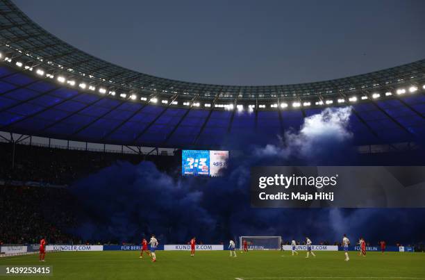 Flares are seen inside the stadium during the Bundesliga match between Hertha BSC and FC Bayern München at Olympiastadion on November 05, 2022 in...