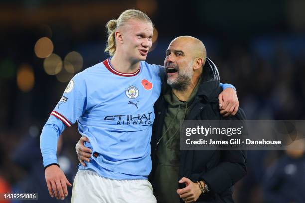 Erling Haaland of Manchester City celebrates with Josep 'Pep' Guardiola, manager of Manchester City, after the Premier League match between...
