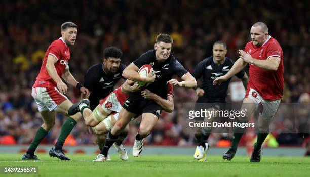 Jordie Barrett of New Zealand is tackled during the Autumn International match between Wales and New Zealand All Blacks at the Principality Stadium...