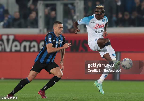 Victor Osimhen of SSC Napoli is challenged by Merih Demiral of Atalanta BC during the Serie A match between Atalanta BC and SSC Napoli at Gewiss...